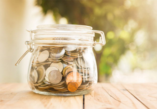 jar of coins on an outside deck